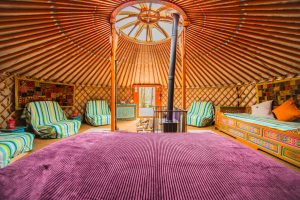 King size bed inside one of the luxury yurts at our glamping site