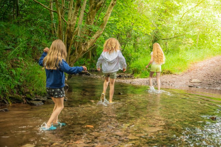 Kids splashing through stream